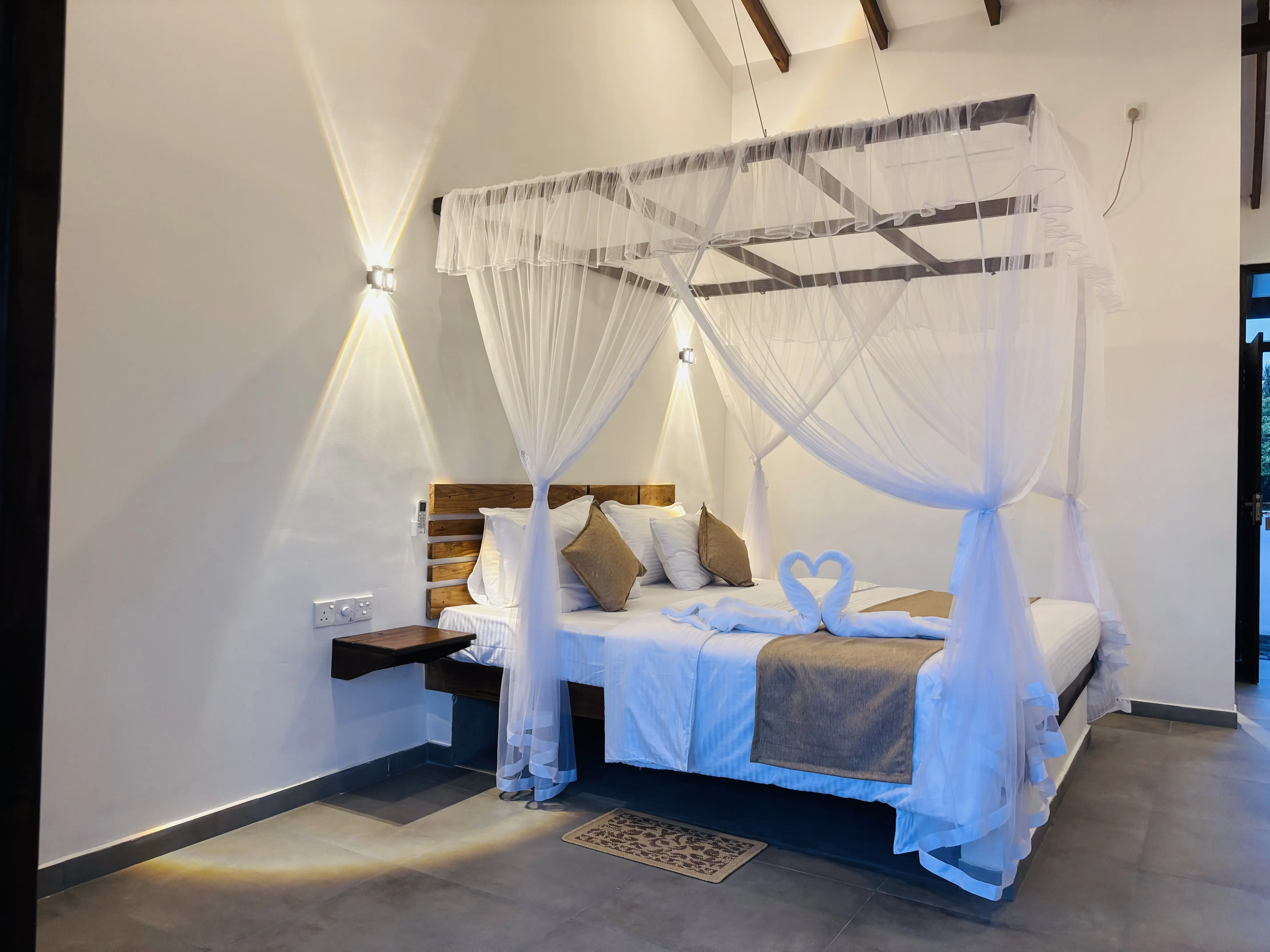 Comfortable king size bed with clean white linens in a guest room