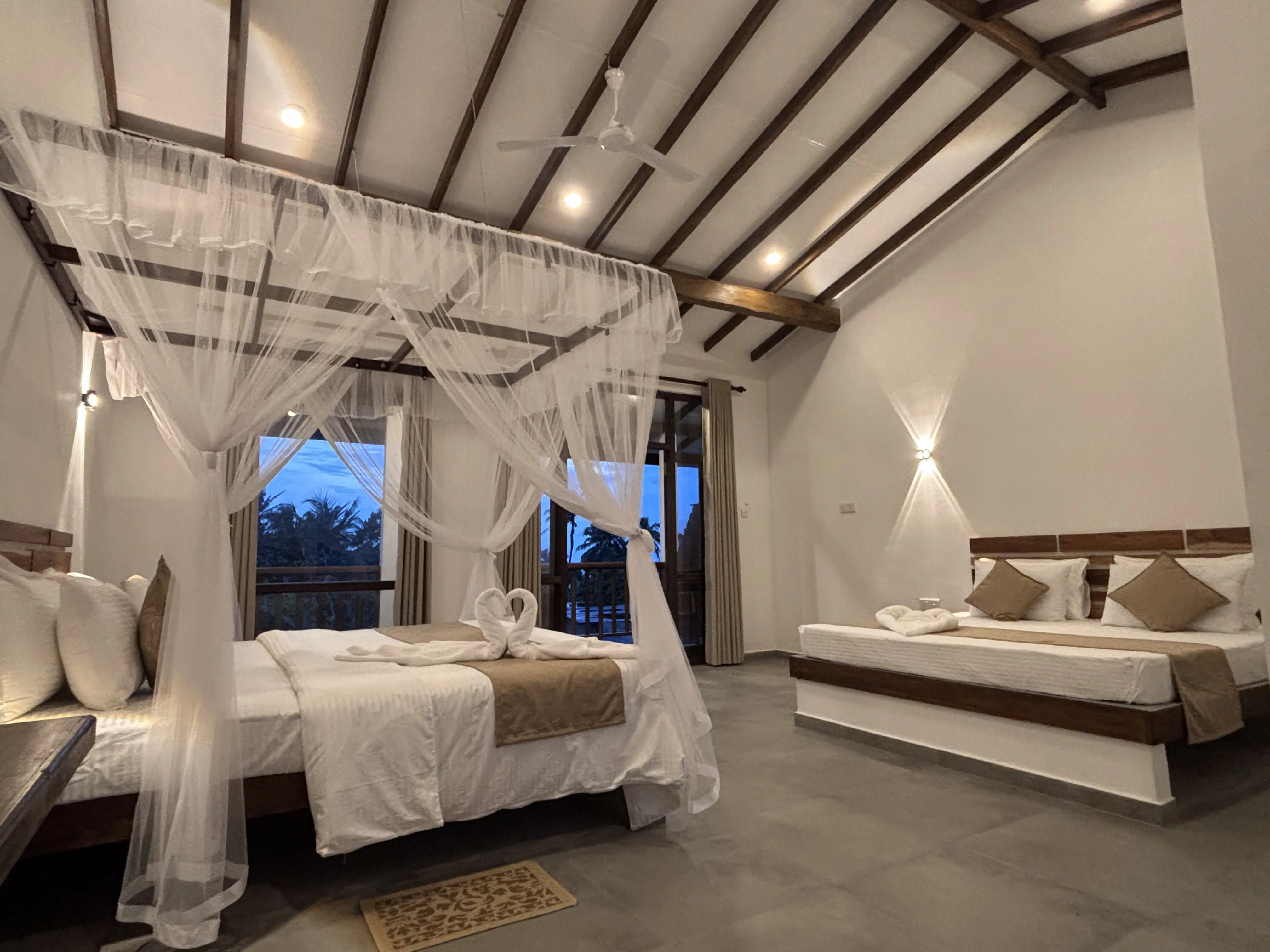 Family room setup with two beds and simple, elegant decor